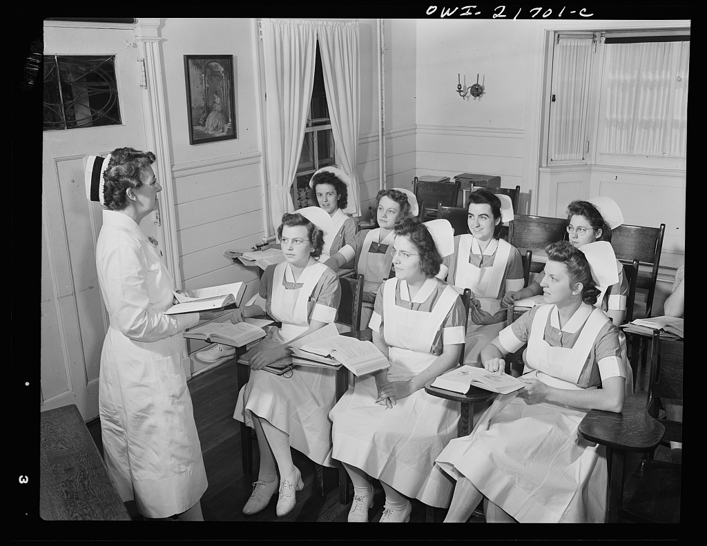 Shirley Babcock at right in the front listening to a lecture with other student nurses [PHOTO: Library of Congress]