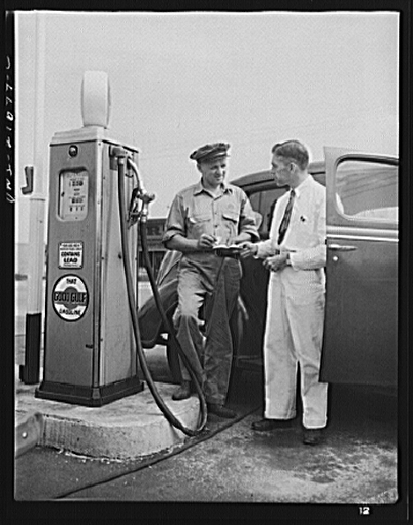 Mr. Babcock explaining an operation to one of the men whom he supervises at the plant [PHOTO: Library of Congress]