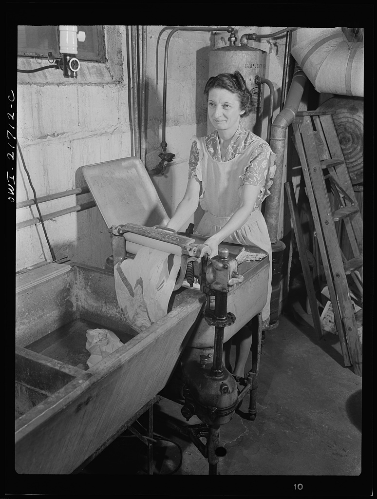 Mrs. Babcock doing the family washing with an electric washing machine and a wringer [PHOTO: Library of Congress]