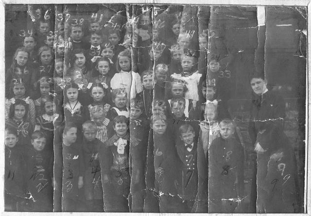 A group portrait of children at Brighton School No. 2, accompanied by their teacher, Kate Lotz (later Mrs. Lays). The school was located at North Avenue (later Winton Road) in Brighton Village. 1902. [PHOTO: Brighton Municipal Historian Collection]