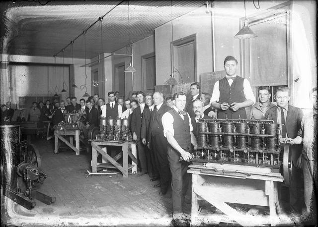 Man assembling engines at the Cunningham Automobile Factory. c.1910-1916. [PHOTO: Albert R. Stone collection]