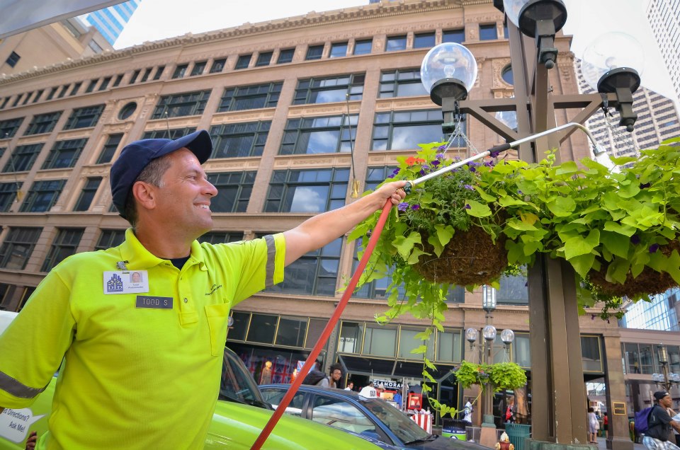 Ambassadors with the Minneapolis Downtown Improvement District provide a variety of services including street cleaning and beautification, providing information, and security. [PHOTO: MinneapolisDID.com]