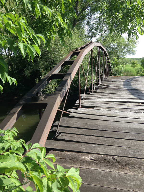 In 1905, the Erie Canal was widened (and renamed to be the New York State Barge Canal) and this bridge was far too short to still be useful. [PHOTO: Chris Clemens]