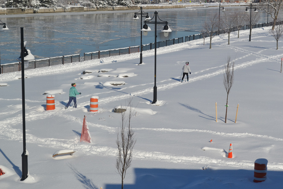 Looking out onto the Genesee Riverway Trail from the apartment. Cross country skiers taking advantage of the conditions. Landscaping will be finished this spring. [PHOTO: RochesterSubway.com]