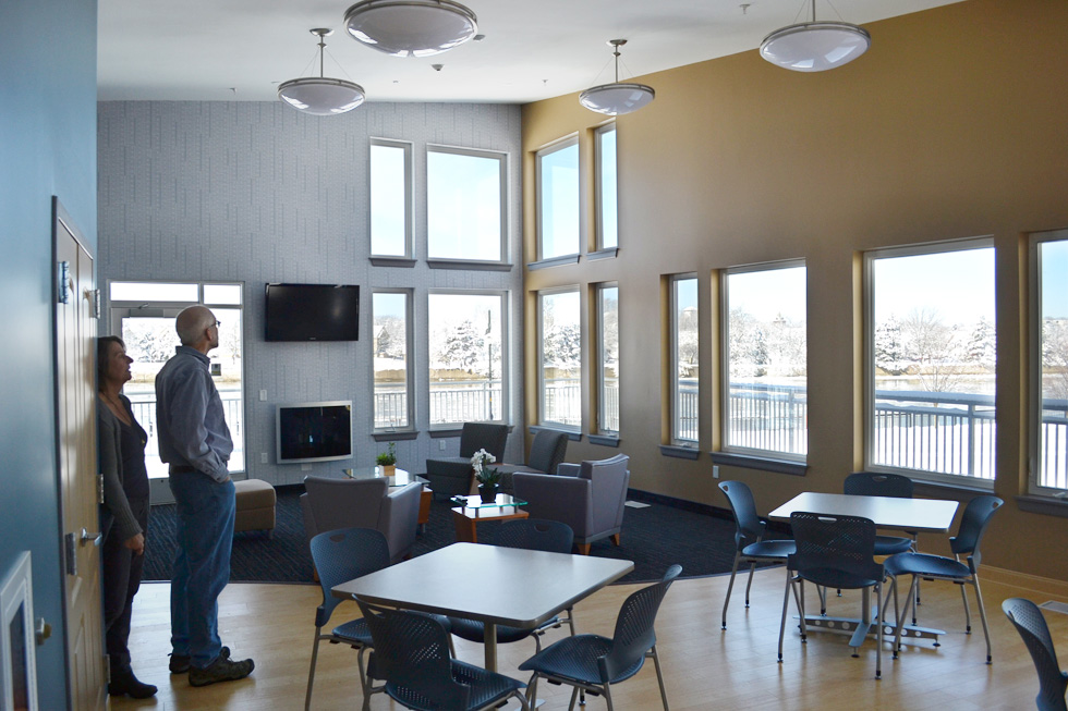 The community room also has a flat screen T.V., a little gas fireplace, a kitchen, and a huge deck wrapped around the outside. [PHOTO: RochesterSubway.com]