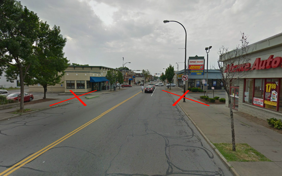 Unnecessary driveways off of Monroe should be removed where ever possible. [IMAGE: Google Streetview]