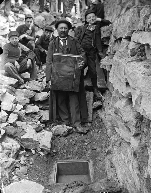 Nick Brayer preparing to lay a time capsule under Front Street, Rochester. 1893. [PHOTO: Rochester Municipal Archives]