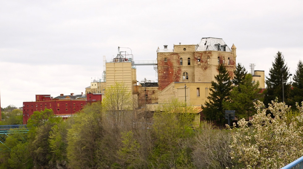 The back side of 13 Cataract Street as seen from a viewing platform near High Falls overlook. [PHOTO: Crystal Pix, Inc.]