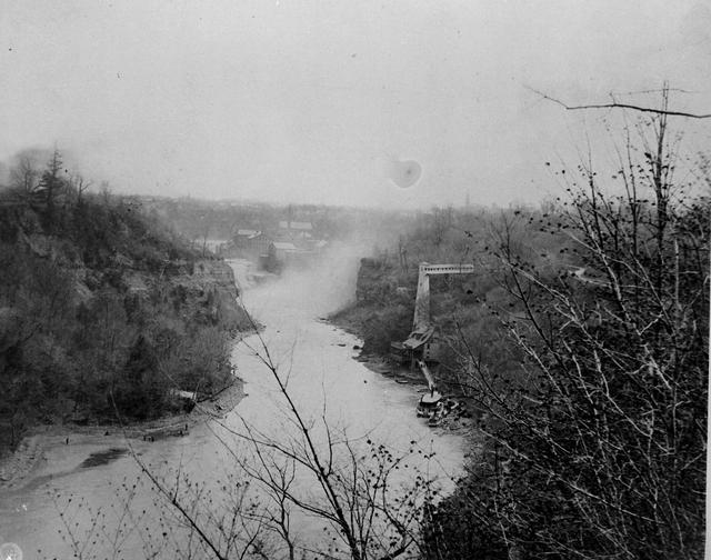 A view of the Genesee River, looking south towards the Glen House, a resort just north of the Lower Falls. The elevator shown was used to carry Glen House patrons to and from the top of the river gorge.  [PHOTO: Rochester Public Library]