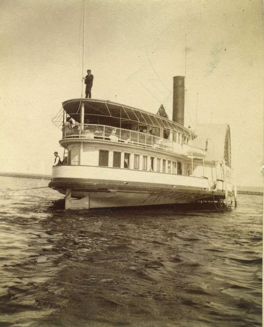 The 'Sylvan Stream' sidewheeler steamboat, seen in the harbor at Charlotte. It was owned by the Rochester and Lake Ontario Steamboat Company, and made daily summer trips between the Glen House and Charlotte. It could carry 800 passengers. c.1886-1894. [PHOTO: Rochester Public Library]