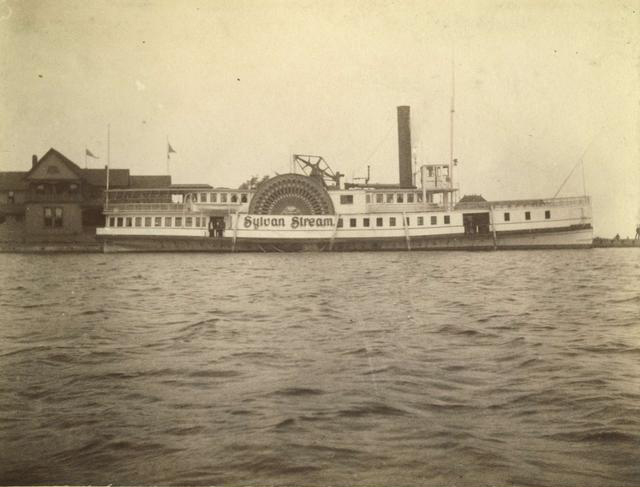 A side view of the 'Sylvan Stream', a sidewheeler steamboat owned by the Rochester and Lake Ontario Steamboat Company. It made daily summer trips between the Glen House and Charlotte. It could carry 800 passengers. c.1886-1894.  [PHOTO: Rochester Public Library]