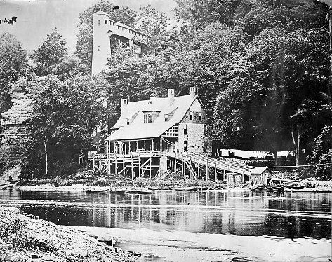 The Glen House stood between the river gorge cliff and the riverbank. When it was built in 1870, patrons had to reach it down approximately 150 steps. The tower and elevator were built in 1878. c.1878-1894. [PHOTO: Albert R. Stone]