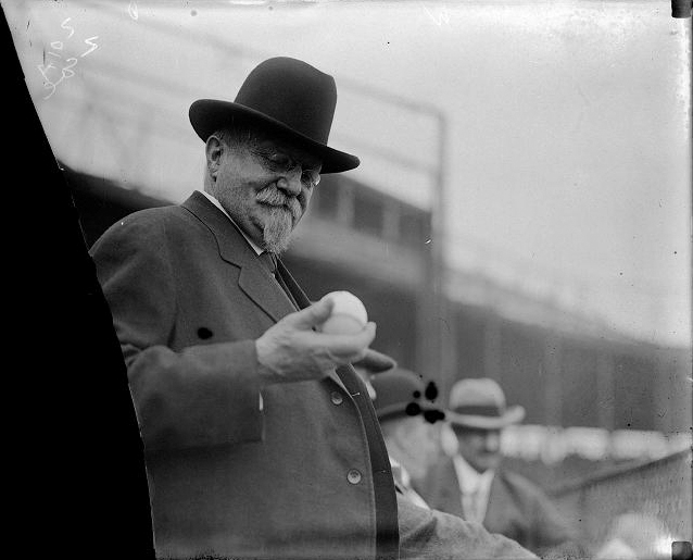 Rochester's Mayor Hiram Edgerton inspecting a baseball at the opening game, May 7, 1912. [PHOTO: Albert R. Stone]