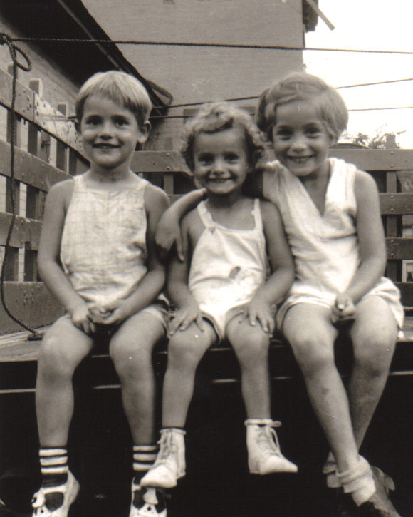Beverly Ferguson (center), Jean Bissiett (right), and their brother Bob (left). On the roof of Iola (c.1939). [PHOTO COURTESY OF: Mark Hosier]