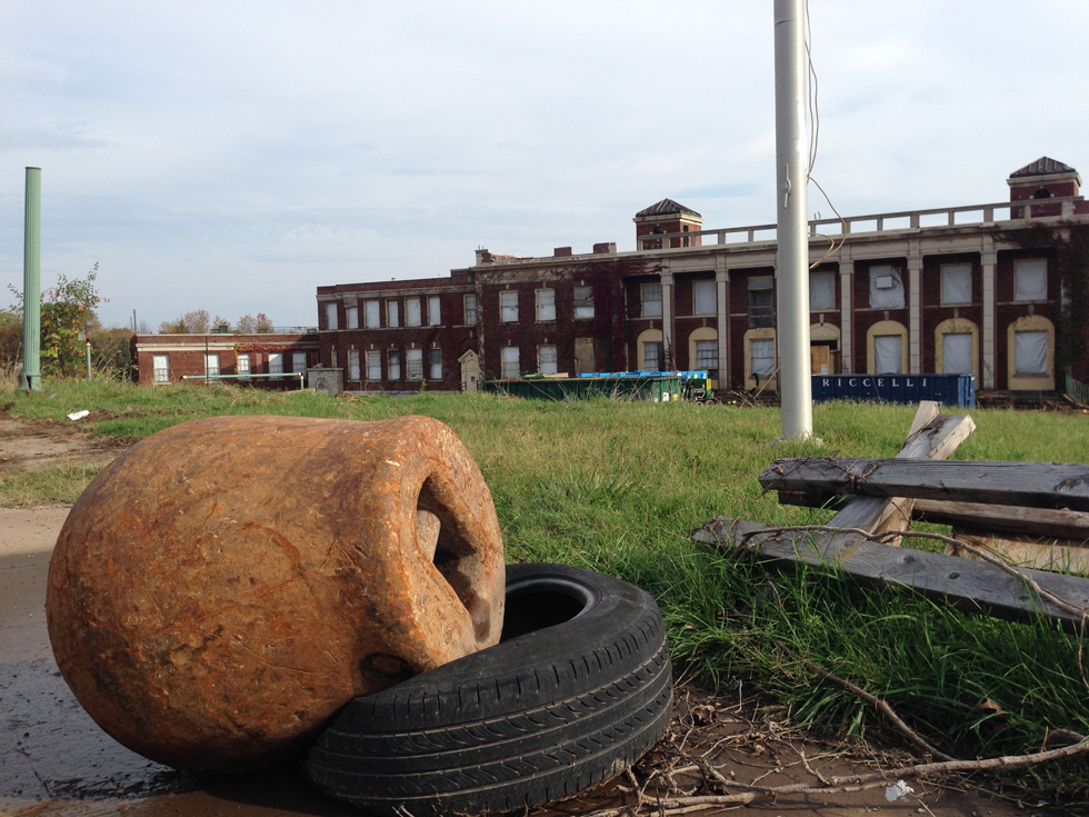 Here the wrecking ball rests on a tire while waiting its job of destroying the Iola main building once the asbestos abatement is complete. [PHOTO: Matt Rieck]