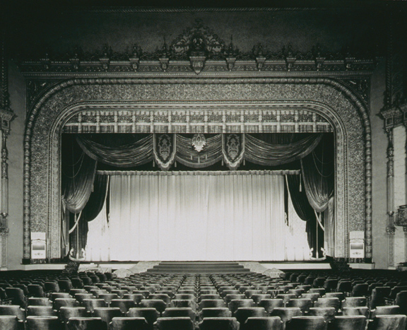 Main Floor & Stage. 1940. With over 3,500 seats it was advertised as the largest theater in America between New York and Chicago. The auditorium featured bronze light fixtures, murals, leather upholstery for the box seats, and an enormous Marr & Colton organ. [PHOTO: Ossie Wieggel / George Eastman House]