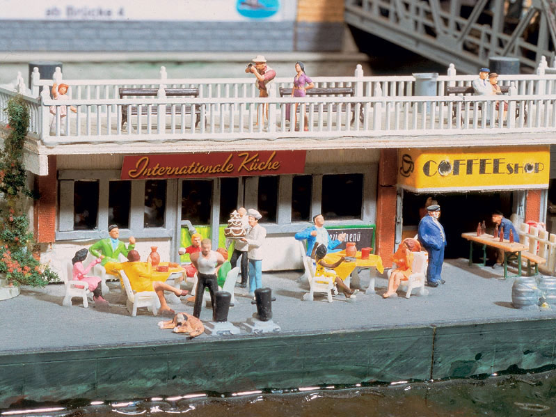 Miniature people visiting a miniature cafe near a miniature River Elbe in a miniature Hamburg Germany. Awe, it's so CUTE!