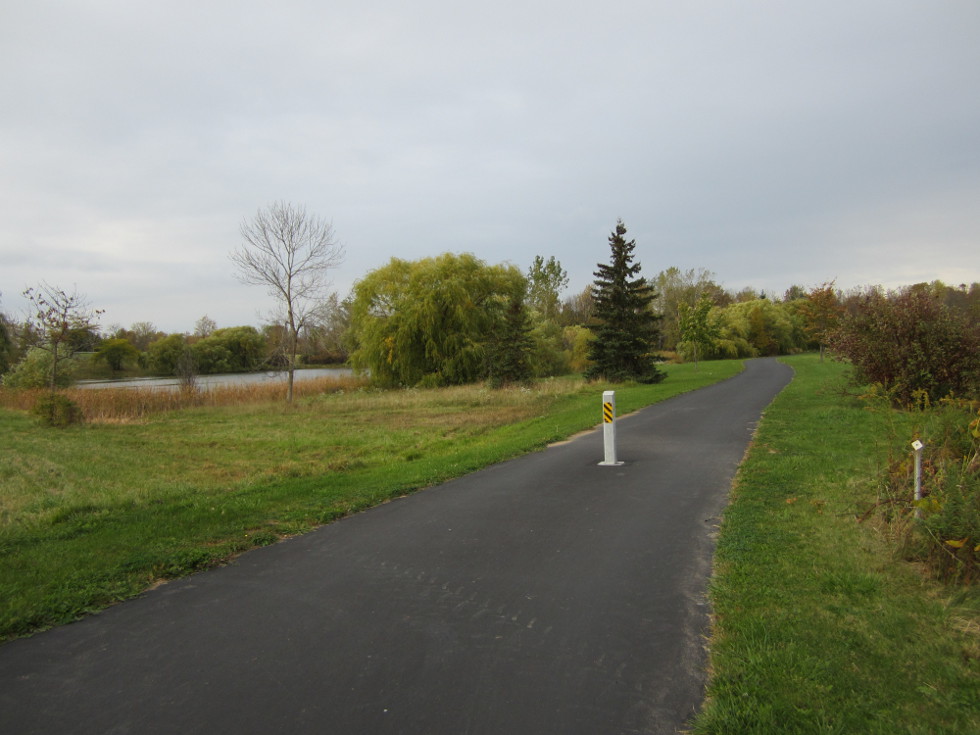 The path turns right, passes by a nice pond, then ends up on Island Cottage Road. [PHOTO: Ryan Green]