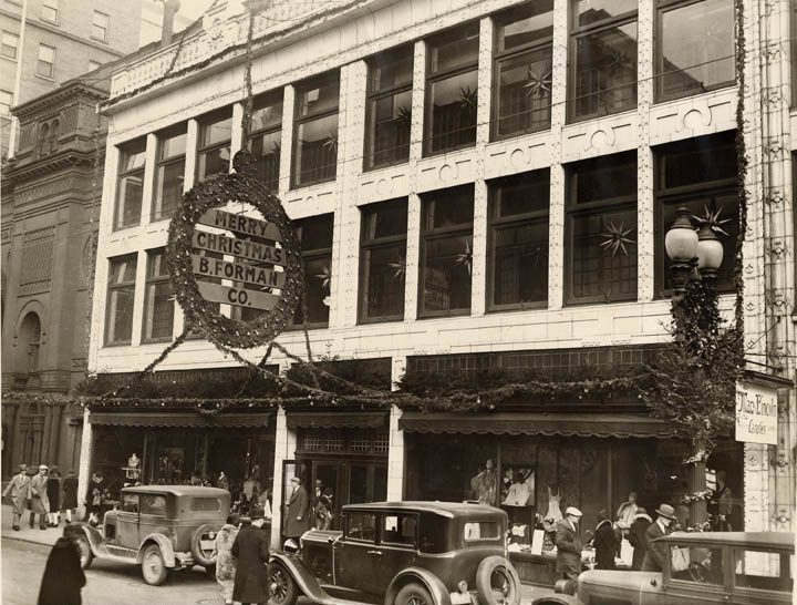 A view of the the facade of the B. Forman Co. store at 46-50 Clinton Avenue South. Christmas decorations are visible. c.1930. [PHOTO: Rochester Public Library]