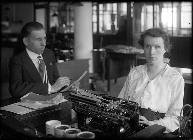 A blind young woman works at a typewriter in a factory on Saint Paul Street. c.1920. [PHOTO: Albert R. Stone Collection]