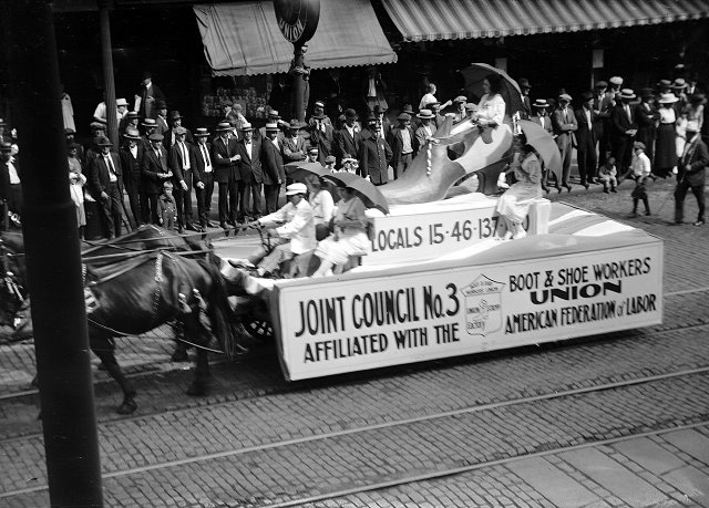 A team of horses pull a float for the Boot and Shoe Workers Union down East Main Street in the 1921 Rochester Labor Day Parade. [PHOTO: Albert R. Stone Collection]
