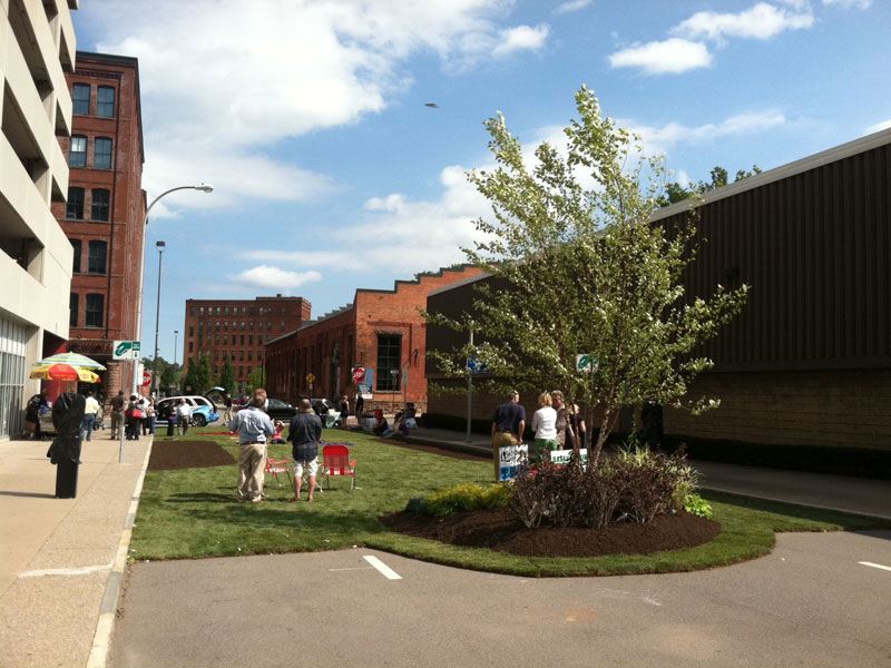 Greentopia Festival gets ready to kick off this weekend. Workers in the High Falls neighborhood were invited to a picnic lunch today on the newly 'green' Commercial Street. But what the hell is that in the sky? [PHOTO: VJ Ortiz]