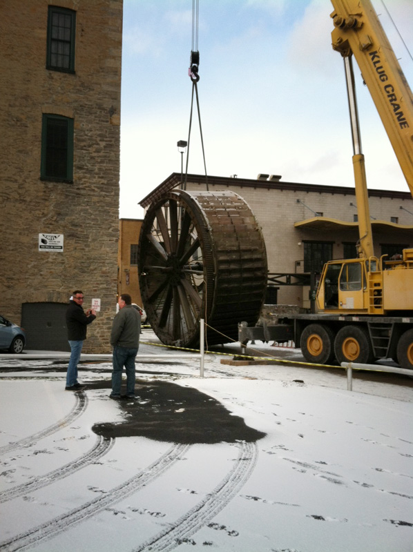 The triphammer water wheel in High Falls, Rochester NY being removed from its housing so it can be restored. [PHOTO: Peter Simpson]