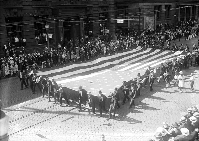 Members of the Silver Platers and Metal Polishers Union carry a large flag in Rochester's 1918 Labor Day Parade. [PHOTO: Albert R. Stone Collection]