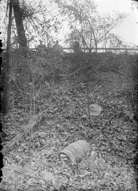 The barrel was covered with a piece of burlap which came off as the barrel rolled down the hill. [PHOTO: Albert R. Stone]
