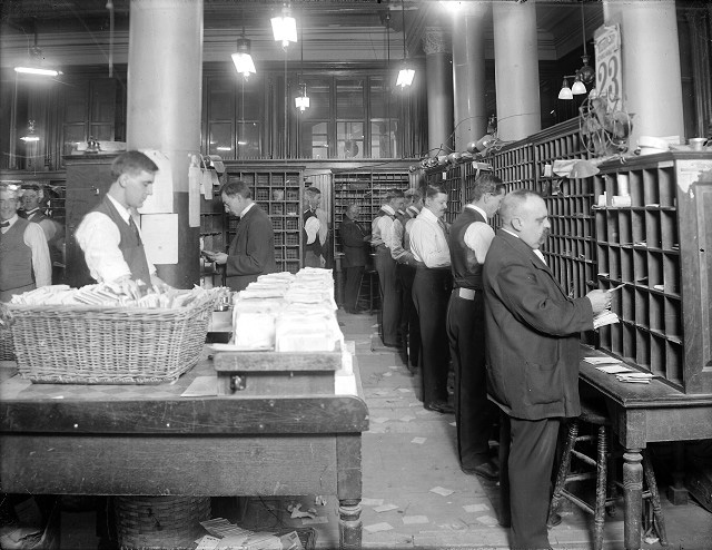 Mail sorters around holiday time. c.1910. [PHOTO: Albert R. Stone Collection]