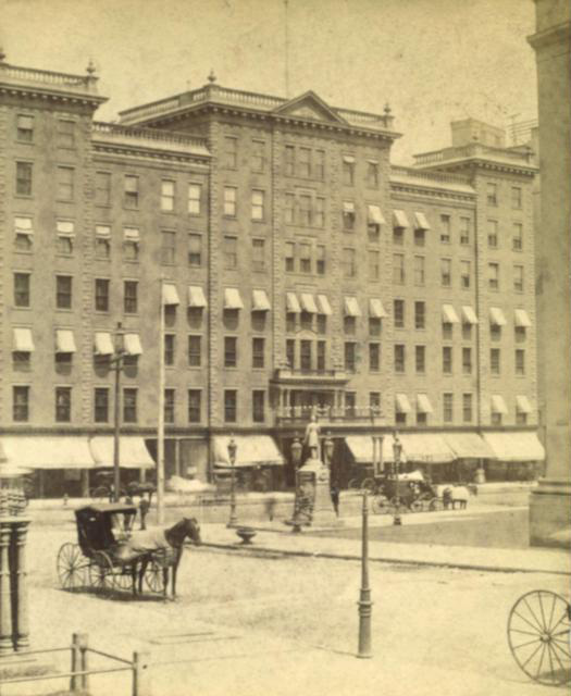 A view of the Cogswell Fountain at the corner of Main and Fitzhugh, looking north with the Powers Hotel in the background. [PHOTO: Rochester Public Library]