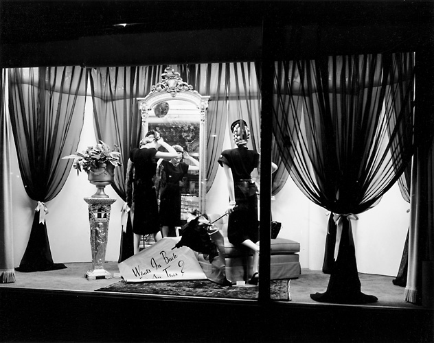 This scene shows mannequins in fashionable dress in front of a mirror. c.1940. [PHOTO: Rochester Public Library]