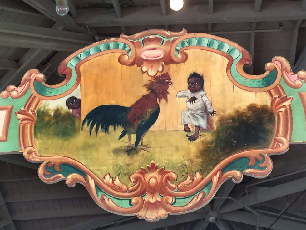 This painted picaninny panel on Rochester's Dentzel carousel has been the subject of debate since the confederate flag was removed from South Carolina's State House in July. [IMAGE: RochesterSubway.com]