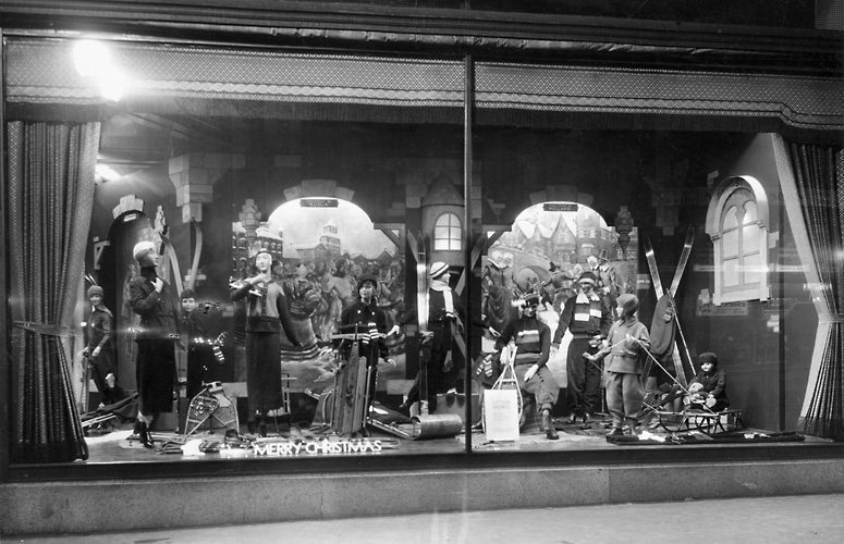A Sibley's window display at Christmas, featuring mannequins in skiwear and showing other winter outerwear as well. 1932. [PHOTO: Rochester Public Library]
