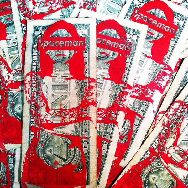 Spaceman print on dollar bills.