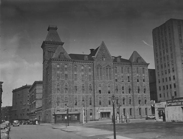 The Rochester City Hall building, as seen looking north from S. Fitzhugh Street and showing the subway entrance on Broad Street. [Image from Rochester Municipal Archives]