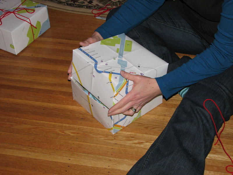Textile artist Jennie Fox fashions gift boxes out of the Rochester Subway map. Jennie sells children's clothes and handmade accessories on Etsy.com.