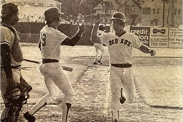 Marty Barrett scores the winning run for Pawtucket in the 33rd inning on June 23, 1981. He is greeted by Wade Boggs. [IMAGE: Associated Press]