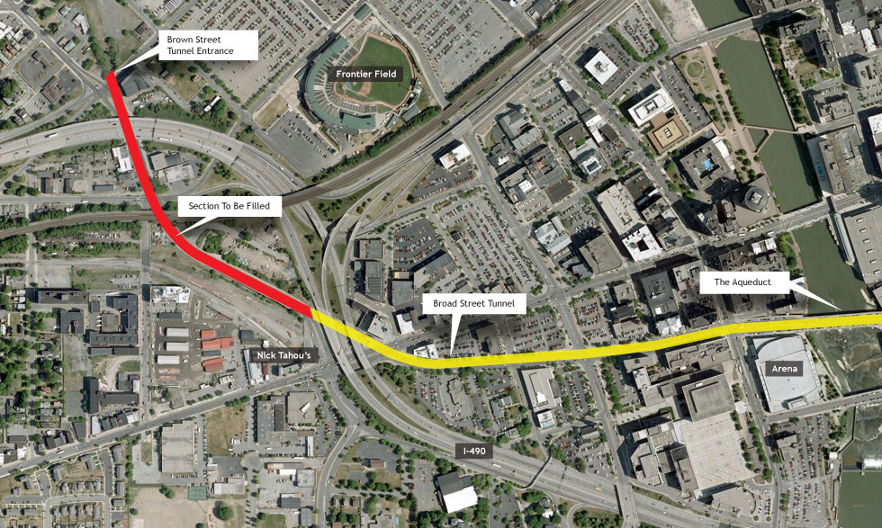 Satellite view of Broad Street in downtown Rochester. The subway tunnel is highlighted with the area to be filled marked red. Image courtesy of Google.