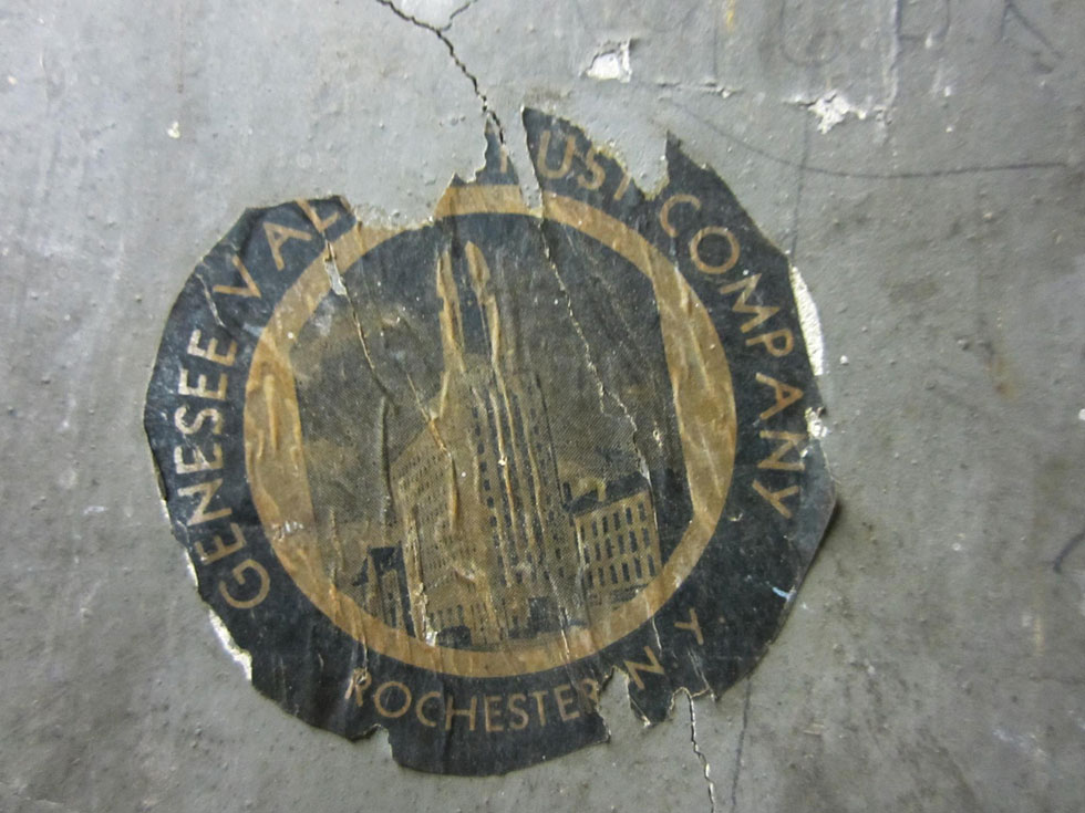 A Genesee Valley Trust Company sticker. GVT was the building's original occupant. They moved out in 1955. [PHOTO: Ryan Green]