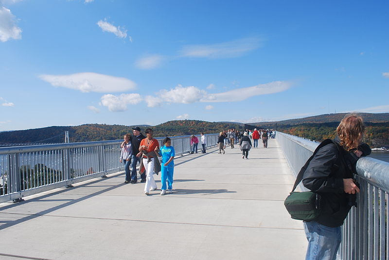 The old rail bridge could be converted to a pedestrian bridge similar to this walkway over the Hudson River. [PHOTO: Julian Colton, Wikimedia Commons]